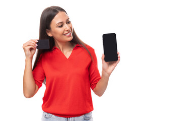 young attractive brunette woman in red stylish v-neck blouse holding smartphone with mockup