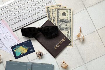 Composition with sunglasses, credit card, money and passport on light tile background