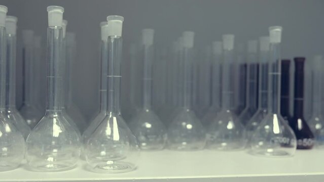 a lot of glass flasks in the laboratory. science medicine