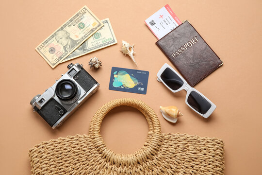 Composition with female bag, credit card, photo camera and sunglasses on color background
