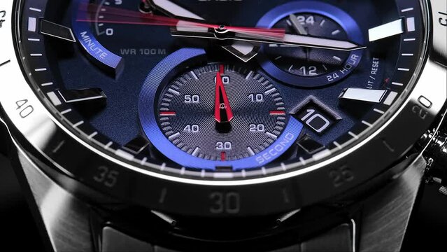 Close Up Of Stylish Luxury Man Wrist Watch With Moving Hand And Multiple Dials. Men's Swiss chronograph watch in metal with sapphire crystal. closeup view of rotating watch , running second arrow
