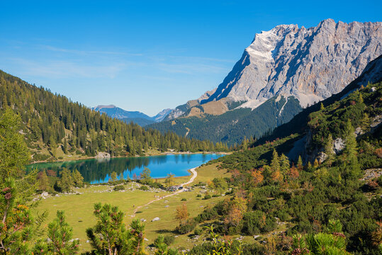 view from hiking trail to Zugspitze mountain and lake Seebensee in autumn