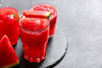 Glasses of tasty watermelon fresh on black background
