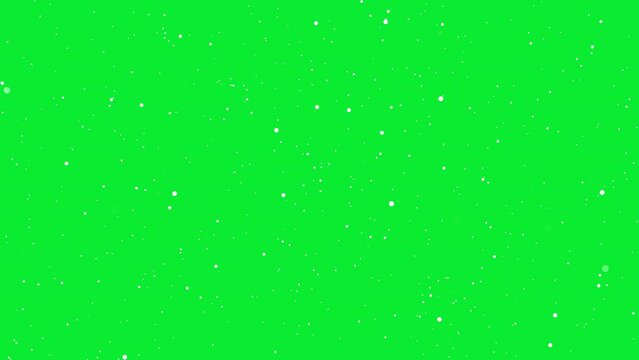 White small round particles on green screen flying forward, abstract animated element of background