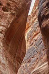 View of the canyon and the high, winding, mountain walls of the canyon. Petra, Jordan
