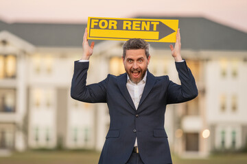 House for rent. Real estate purchase and rent concept. Real estate services. Confident man in suit, real estate agent, professional realtor renting new house. Rental apartment.