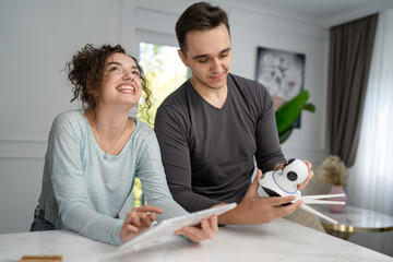 young couple man and woman starting home security surveillance camera