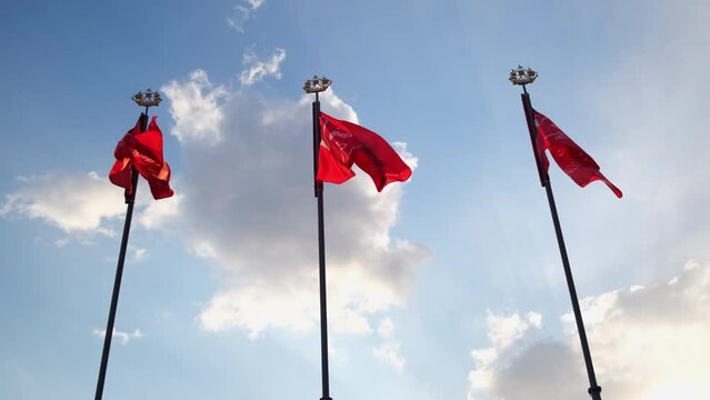 the red flag flutters in the wind