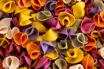 Rainbow pasta texture including pink, purple, orange, green and yellow