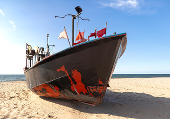 Fishing boat on the beach of the Baltic Sea in Poland. Miedzyzdroje © jarizPJ