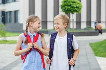 Back to school. Classmates backpack behind back. Children go to school for study.