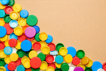 Colorful bottle caps background cardboard box. Used PET recycling plastic bottle cap plastic lids....