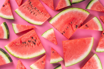 Sliced watermelons on pink background
