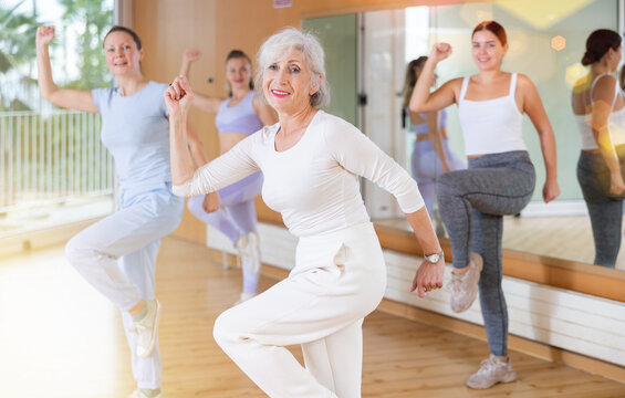 Women dancing aerobics at lesson in the dance class