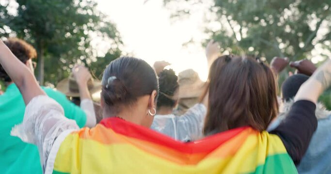 Dance lgbt and pride with people and rainbow flag in parade for celebration, support and freedom. Diversity, love and peace with group of friends dancing in festival for human rights and solidarity