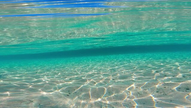Split shot of the sea, half above, half below water shot of a tropical beach in Indonesia, south pacific ocean coast, vacation in Bali