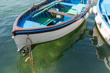 Fototapeta na wymiar Traditional fishing dinghy moored with rope