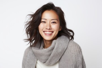 Portrait of a beautiful young asian woman smiling on white background