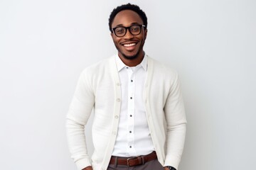 Obraz premium Happy african american man in eyeglasses standing against white background