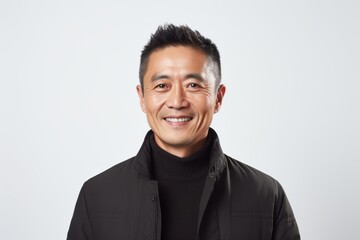 Portrait of an asian man smiling isolated on a white background