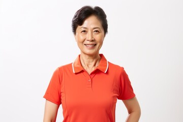 Portrait of a senior asian woman in orange polo shirt.