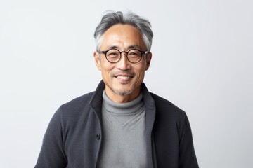 Obraz premium Portrait of Asian senior man wearing eyeglasses on white background