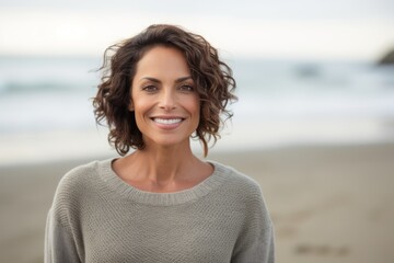 Portrait of smiling woman standing on beach at the day time with copy space