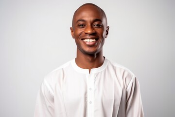Fototapeta premium Portrait of a young african american man smiling isolated on a white background