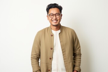 Portrait of a happy young asian man wearing eyeglasses