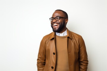 Obraz premium Portrait of a happy young african american man smiling on white background