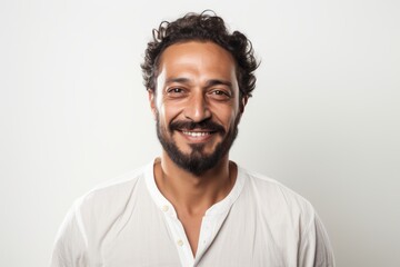 Fototapeta premium Portrait of a handsome young man smiling at camera isolated on a white background