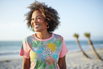 Portrait of happy african american woman smiling at the beach