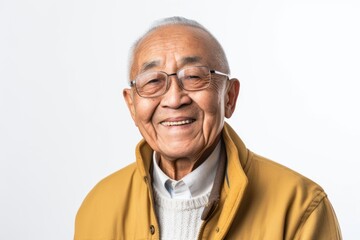 Fototapeta premium Portrait of a senior asian man in yellow jacket on white background