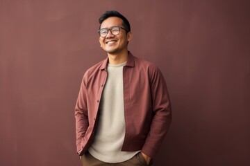 Obraz premium Portrait of a happy young indian man wearing eyeglasses