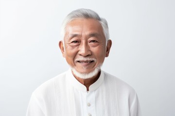 Portrait of an old asian man with white hair on white background