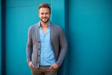 Lifestyle portrait photography of a cheerful Russian man in his 30s wearing a chic cardigan against an abstract background 