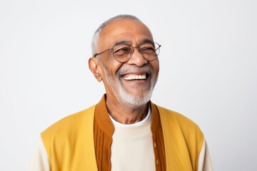 Obraz premium Portrait of happy senior Indian man in eyeglasses smiling and looking at camera
