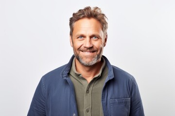 Obraz premium Portrait of a handsome middle-aged man smiling at the camera