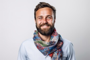 Obraz premium Portrait of a handsome bearded man with a scarf on his neck