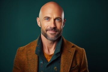 Obraz premium Portrait of a bald man with a beard in a jacket.