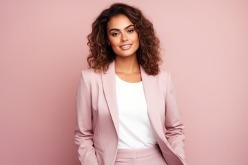 Fototapeta premium Beautiful young african american woman with curly hair on pink background