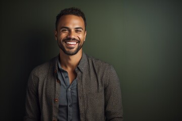 Fototapeta premium Portrait of a handsome african american man looking at camera and smiling