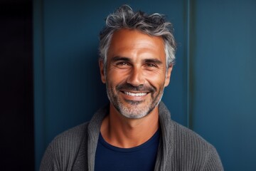 Obraz premium Portrait of a handsome middle-aged man smiling at the camera