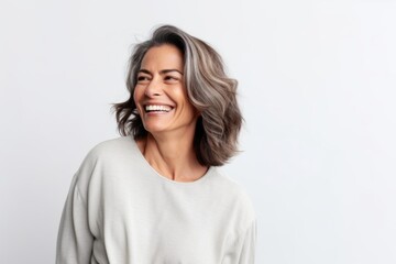 Obraz premium Portrait of happy middle-aged woman with grey hair laughing and looking at camera isolated over white background