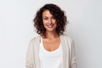 Medium shot portrait photography of a satisfied Brazilian woman in her 30s wearing a chic cardigan against a white background 