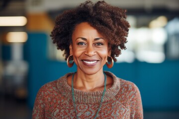 Lifestyle portrait photography of a pleased Nigerian woman in her 40s wearing a cozy sweater against an abstract background 