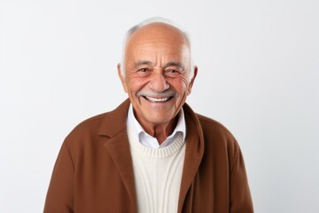 Obraz premium Portrait of a happy senior man smiling at the camera on white background