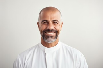 Portrait of a smiling mature man in a white t-shirt