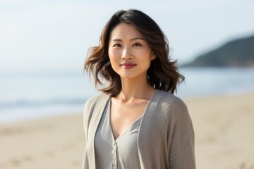 Portrait of a beautiful asian woman smiling on the beach.
