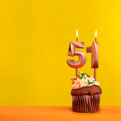 Number 51 birthday candle - Celebration on yellow background